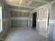 Unfinished room showcasing drywall, door frames, and spacious layout at 70 Prency Ln, Middlesex, NC 27557