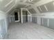 Unfinished attic room showcasing drywall, door frames, and spacious layout at 70 Prency Ln, Middlesex, NC 27557