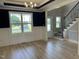 Dining room featuring a large window, wood floors, and wainscoting at 70 Prency Ln, Middlesex, NC 27557