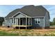 Exterior view of new home with screened porch and vinyl siding, showing design and layout at 70 Prency Ln, Middlesex, NC 27557