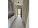 Hallway with neutral walls, cabinetry, and natural light, highlighting the design and functionality at 70 Prency Ln, Middlesex, NC 27557