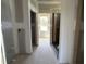 A hallway leads to a bright window, offering a glimpse of the outdoors and ample natural light at 70 Prency Ln, Middlesex, NC 27557