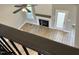 Upstairs view of the living room featuring a fireplace, wood floors, and natural light at 70 Prency Ln, Middlesex, NC 27557