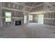 Spacious room with fireplace and large windows creates a bright and airy atmosphere at 70 Prency Ln, Middlesex, NC 27557