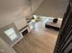 Open-concept living room featuring a fireplace, wood floors, and natural light at 70 Prency Ln, Middlesex, NC 27557