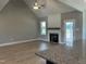 Spacious living room with a fireplace, wood floors, and a ceiling fan at 70 Prency Ln, Middlesex, NC 27557