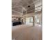 Open-concept living space featuring a kitchen island, dining area, and staircase to the second level at 70 Prency Ln, Middlesex, NC 27557