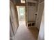 Well-organized mudroom with built-in storage bench, cubbies, and access to multiple rooms and exterior at 70 Prency Ln, Middlesex, NC 27557