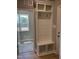 Welcoming mudroom with custom built-ins including bench, hooks, and shelving; convenient and stylish entryway storage at 70 Prency Ln, Middlesex, NC 27557