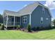 Two-story home features a well-maintained lawn, landscaping, a screened porch, and a beautiful lawn at 70 Prency Ln, Middlesex, NC 27557