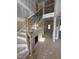 Elegant staircase with wrought iron balusters, wood treads, and natural light showcasing architectural detail at 70 Prency Ln, Middlesex, NC 27557
