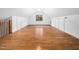 Spacious upstairs bedroom with wood floors, white walls, and dormer windows at 7132 Linda Rae Dr, Zebulon, NC 27597