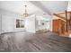 Open concept living room flows into the bright white kitchen at 7132 Linda Rae Dr, Zebulon, NC 27597