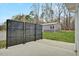 Spacious backyard featuring a privacy screen, shed, and lawn area at 765 Townsville Landing Rd, Henderson, NC 27537