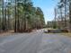 Scenic entrance to Steele Creek Marina with lush trees and a gated entryway at 765 Townsville Landing Rd, Henderson, NC 27537