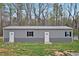 Exterior view of gray sided single story home with grass lawn at 765 Townsville Landing Rd, Henderson, NC 27537