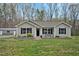 Charming single-story home with black shutters and a landscaped front yard at 765 Townsville Landing Rd, Henderson, NC 27537