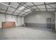 Spacious garage featuring ample storage space and bright overhead lighting at 765 Townsville Landing Rd, Henderson, NC 27537
