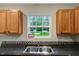 Kitchen sink with stainless steel faucet and a window view of the outdoors at 765 Townsville Landing Rd, Henderson, NC 27537