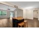 Open living space featuring wood floors, modern lighting, and a kitchen island with seating at 765 Townsville Landing Rd, Henderson, NC 27537