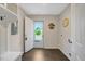 Bright mudroom with storage bench and hooks, leading to the outdoors at 765 Townsville Landing Rd, Henderson, NC 27537