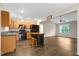 Open concept kitchen and living area with dark wood flooring and modern appliances at 765 Townsville Landing Rd, Henderson, NC 27537