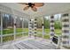 Enclosed sunroom offering panoramic views and comfortable seating space at 765 Townsville Landing Rd, Henderson, NC 27537