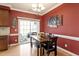 Cozy dining area with sliding glass doors and seating for six, perfect for Gathering meals at 801 Myrtle Grove Ln, Apex, NC 27502
