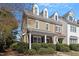 Beautiful townhome with dormer windows and a well-maintained front yard at 801 Myrtle Grove Ln, Apex, NC 27502