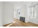 Sunlit bedroom boasts hardwood floors, neutral walls, and bright windows for a clean, inviting space at 802 Pleasant Dr, Durham, NC 27703