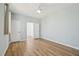 Bright bedroom featuring hardwood floors, white doors, neutral paint, and a ceiling fan at 802 Pleasant Dr, Durham, NC 27703
