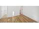 Bedroom with hardwood floors and white walls showcasing natural light and a modern, minimalist aesthetic at 802 Pleasant Dr, Durham, NC 27703