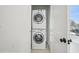 Convenient, closeted laundry area with stacked washer and dryer, maximizing space at 802 Pleasant Dr, Durham, NC 27703