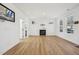 Bright living room with wood floors and a cozy fireplace, perfect for relaxing at 802 Pleasant Dr, Durham, NC 27703