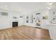 A bright living area with hardwood floors and an electric fireplace at 802 Pleasant Dr, Durham, NC 27703
