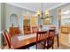 Inviting dining room featuring a chandelier, a large table, and seating for six, perfect for Gathering meals at 829 Federal House Ave, Wake Forest, NC 27587