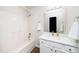Bathroom featuring a shower-tub combo and updated vanity at 936 Amersham Ln, Wake Forest, NC 27587