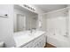 Bathroom featuring a shower-tub combo and updated vanity at 936 Amersham Ln, Wake Forest, NC 27587