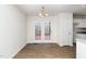 Dining room with hardwood floors and access to the deck, ideal for Gathering meals at 936 Amersham Ln, Wake Forest, NC 27587