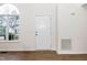Bright entryway with hardwood floors and a large window, creating a welcoming atmosphere at 936 Amersham Ln, Wake Forest, NC 27587