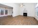 Spacious living room with hardwood floors, fireplace, and access to the deck, perfect for entertaining at 936 Amersham Ln, Wake Forest, NC 27587