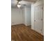 Empty bedroom with wood-look floors and white walls with two closets at 100 Blackberry Creek Dr, Willow Springs, NC 27592