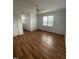 Bedroom with white walls and ceiling fan and wood-look floors at 100 Blackberry Creek Dr, Willow Springs, NC 27592