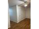 Bedroom with white walls, a ceiling fan, a closet door, and wood look floors at 100 Blackberry Creek Dr, Willow Springs, NC 27592