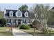 Charming two-story home with black shutters, white trim, and manicured lawn at 100 Blackberry Creek Dr, Willow Springs, NC 27592
