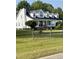 Classic two-story home with black shutters, a chimney, white trim, and large front yard at 100 Blackberry Creek Dr, Willow Springs, NC 27592