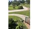 Beautifully landscaped front yard with a winding walkway and vibrant greenery at 100 Blackberry Creek Dr, Willow Springs, NC 27592