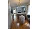Bright kitchen features gray cabinets, wood floors, and a central island with counter seating at 100 Blackberry Creek Dr, Willow Springs, NC 27592