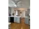 Bright kitchen featuring gray cabinets, a black dishwasher, and a chandelier at 100 Blackberry Creek Dr, Willow Springs, NC 27592