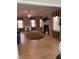 Bright living room featuring a fireplace, hardwood floors, and classic window treatments at 100 Blackberry Creek Dr, Willow Springs, NC 27592